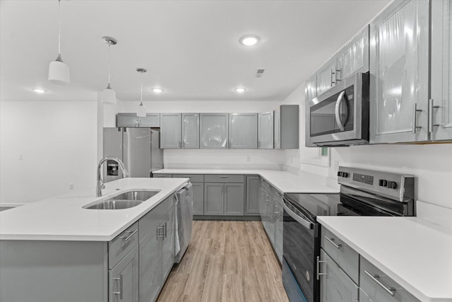 54 Austin Cir, Rossville, GA 30741 - kitchen with stainless steel appliances, gray cabinets, hanging light fixtures, recessed lighting, and light countertops