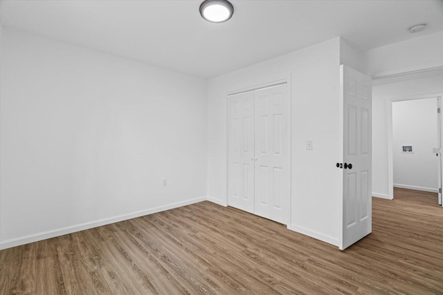 54 Austin Cir, Rossville, GA 30741 - unfurnished bedroom featuring wood finished floors and a closet