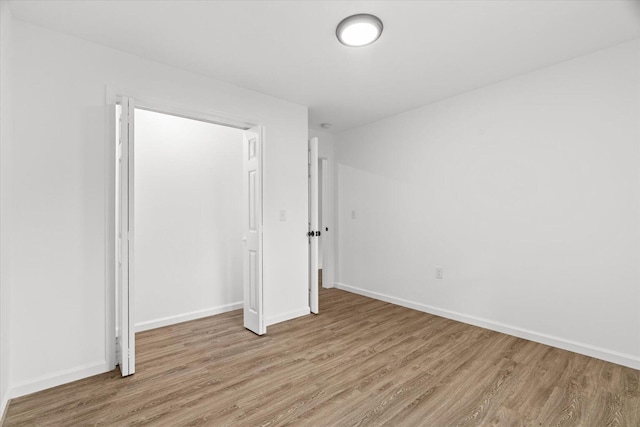 54 Austin Cir, Rossville, GA 30741 - unfurnished bedroom with light wood-style flooring and a closet