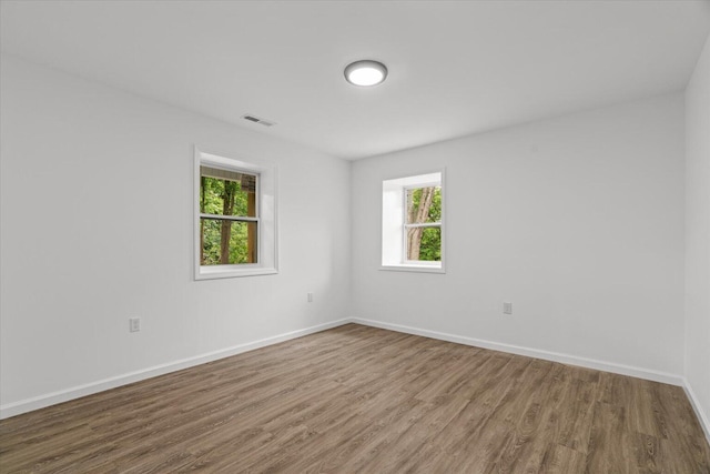 54 Austin Cir, Rossville, GA 30741 - unfurnished room with wood finished floors and healthy amount of natural light