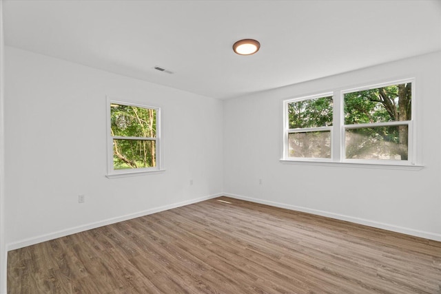 54 Austin Cir, Rossville, GA 30741 - empty room with plenty of natural light and wood finished floors