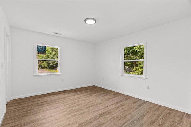 54 Austin Cir, Rossville, GA 30741 - empty room featuring light wood-style floors and plenty of natural light