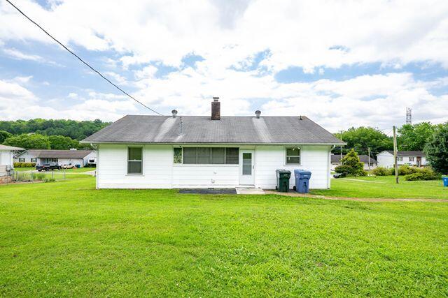 3313 Harrison Pike, Chattanooga, TN 37416 - back of property featuring a yard and a chimney