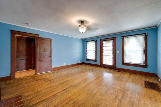3313 Harrison Pike, Chattanooga, TN 37416 - empty room featuring light wood finished floors and ornamental molding