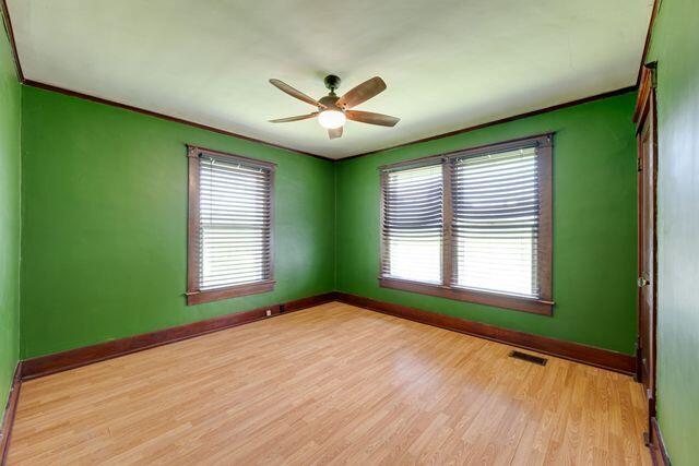 3313 Harrison Pike, Chattanooga, TN 37416 - unfurnished room featuring a ceiling fan, light wood-type flooring, and crown molding