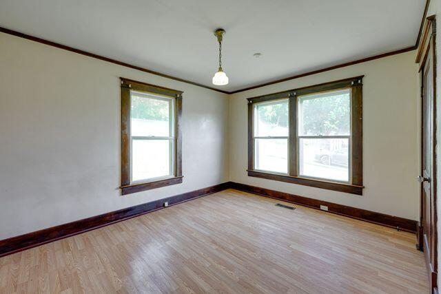 3313 Harrison Pike, Chattanooga, TN 37416 - unfurnished room featuring ornamental molding and light wood-type flooring