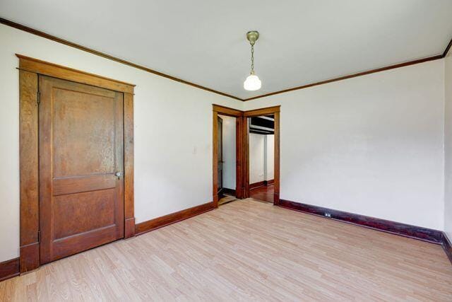 3313 Harrison Pike, Chattanooga, TN 37416 - unfurnished room featuring crown molding and light wood-style floors