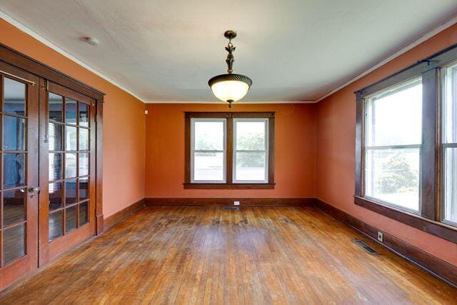 3313 Harrison Pike, Chattanooga, TN 37416 - unfurnished room with wood finished floors, crown molding, french doors, and plenty of natural light