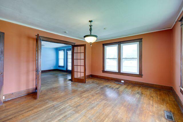 3313 Harrison Pike, Chattanooga, TN 37416 - spare room featuring crown molding and wood finished floors