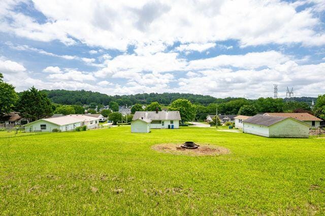 3313 Harrison Pike, Chattanooga, TN 37416 - view of green lawn featuring a fire pit