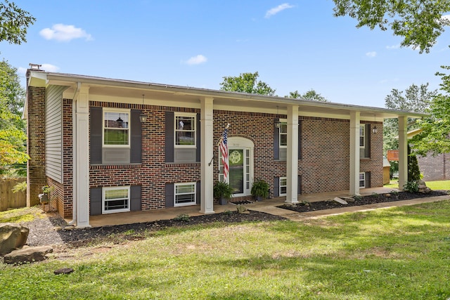 7622 Nadick Ln, Hixson, TN 37343 - bi-level home featuring brick siding and a patio area