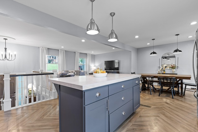 7622 Nadick Ln, Hixson, TN 37343 - kitchen with light countertops, open floor plan, a kitchen island, recessed lighting, and decorative light fixtures