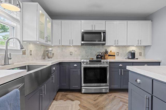 7622 Nadick Ln, Hixson, TN 37343 - kitchen featuring stainless steel appliances, light countertops, gray cabinets, and white cabinets