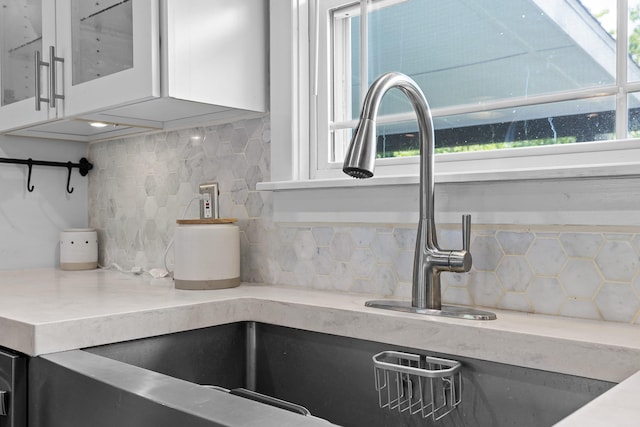 7622 Nadick Ln, Hixson, TN 37343 - kitchen view of decorative backsplash, white cabinets, and glass insert cabinets
