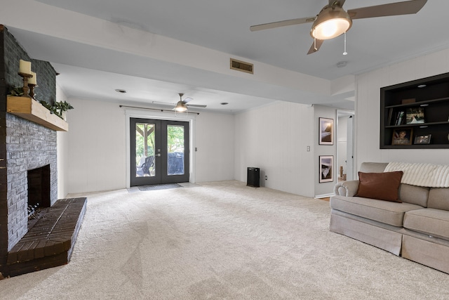 7622 Nadick Ln, Hixson, TN 37343 - living area featuring a ceiling fan, a fireplace, carpet flooring, and french doors