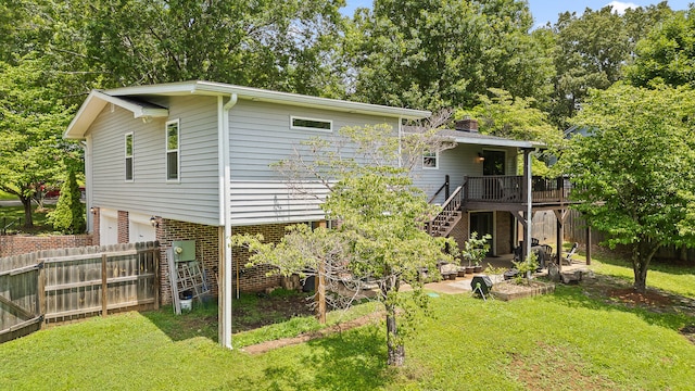 7622 Nadick Ln, Hixson, TN 37343 - rear view of house featuring stairs, a wooden deck, an attached garage, a patio area, and a chimney