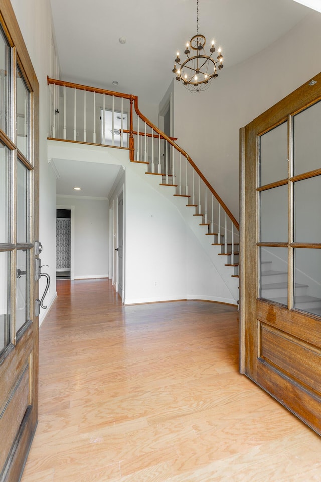 11216 Ooltewah Georgetown Rd, Georgetown, TN 37336 - entryway with stairway, a chandelier, light wood finished floors, and a high ceiling