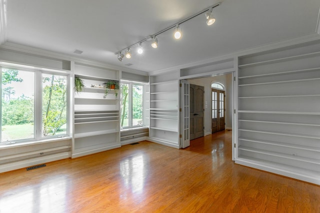 11216 Ooltewah Georgetown Rd, Georgetown, TN 37336 - empty room with ornamental molding, plenty of natural light, wood finished floors, and track lighting