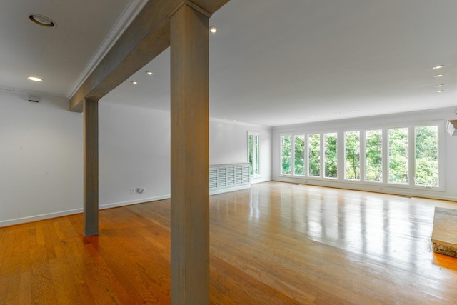 11216 Ooltewah Georgetown Rd, Georgetown, TN 37336 - empty room featuring decorative columns, healthy amount of natural light, ornamental molding, wood finished floors, and recessed lighting
