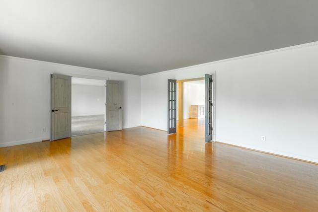 11216 Ooltewah Georgetown Rd, Georgetown, TN 37336 - spare room featuring light wood-style flooring and crown molding