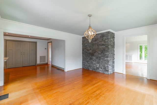 11216 Ooltewah Georgetown Rd, Georgetown, TN 37336 - unfurnished room with a chandelier, light wood finished floors, and ornamental molding