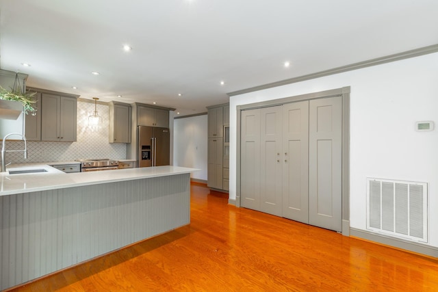 11216 Ooltewah Georgetown Rd, Georgetown, TN 37336 - kitchen featuring stainless steel appliances, gray cabinets, a peninsula, light wood finished floors, and light countertops