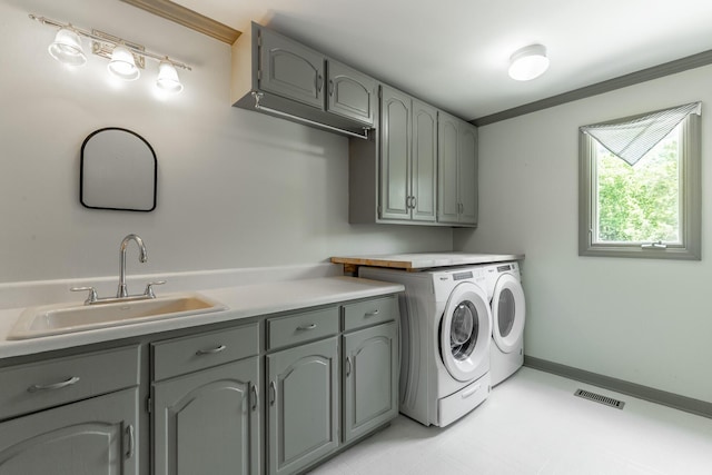 11216 Ooltewah Georgetown Rd, Georgetown, TN 37336 - laundry area featuring washer and dryer, cabinet space, and ornamental molding
