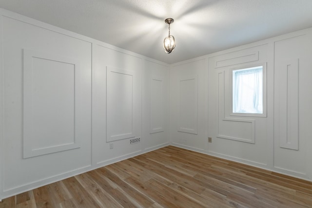 11216 Ooltewah Georgetown Rd, Georgetown, TN 37336 - unfurnished room featuring light wood-style flooring and a decorative wall