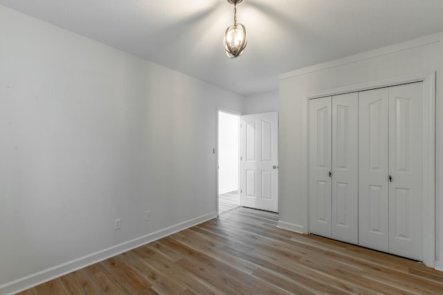 11216 Ooltewah Georgetown Rd, Georgetown, TN 37336 - unfurnished bedroom with light wood finished floors and a closet