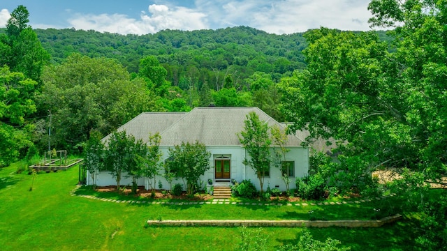11216 Ooltewah Georgetown Rd, Georgetown, TN 37336 - view of front of house featuring a wooded view, stucco siding, entry steps, and a front lawn