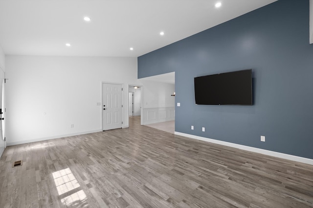 651 Howard Leonard Rd, Ringgold, GA 30736 - unfurnished living room with light wood-style flooring, recessed lighting, and lofted ceiling