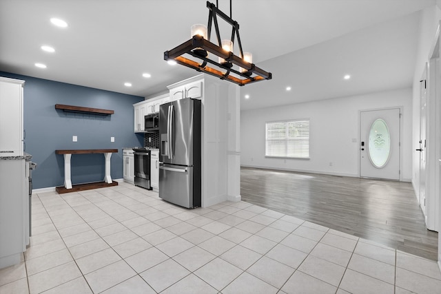 651 Howard Leonard Rd, Ringgold, GA 30736 - kitchen featuring stainless steel appliances, recessed lighting, white cabinets, light tile patterned flooring, and open floor plan