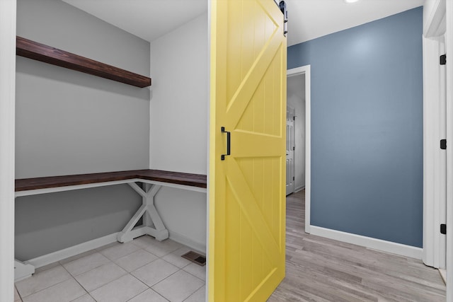 651 Howard Leonard Rd, Ringgold, GA 30736 - hallway featuring a barn door and wood finished floors