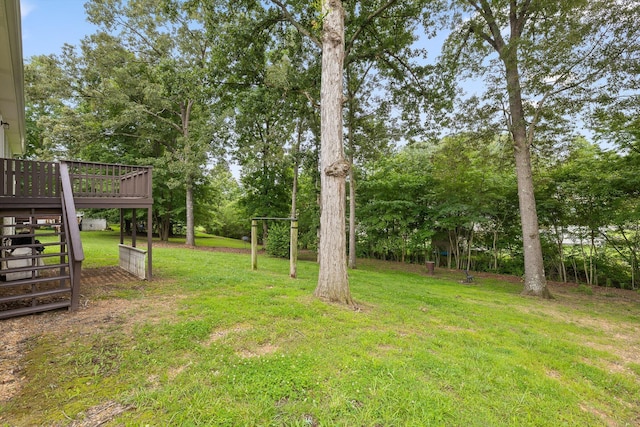 651 Howard Leonard Rd, Ringgold, GA 30736 - view of grassy yard with stairway, a deck, and view of wooded area