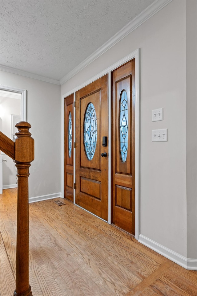 8512 Creek Stone Dr, Chattanooga, TN 37421 - entryway featuring light wood finished floors, crown molding, and a textured ceiling