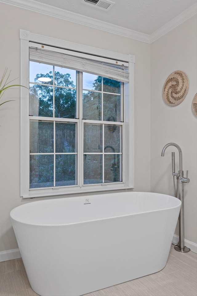 8512 Creek Stone Dr, Chattanooga, TN 37421 - bathroom featuring a freestanding bath and crown molding