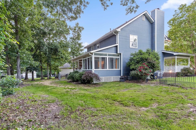 8512 Creek Stone Dr, Chattanooga, TN 37421 - view of side of home with a chimney and a sunroom
