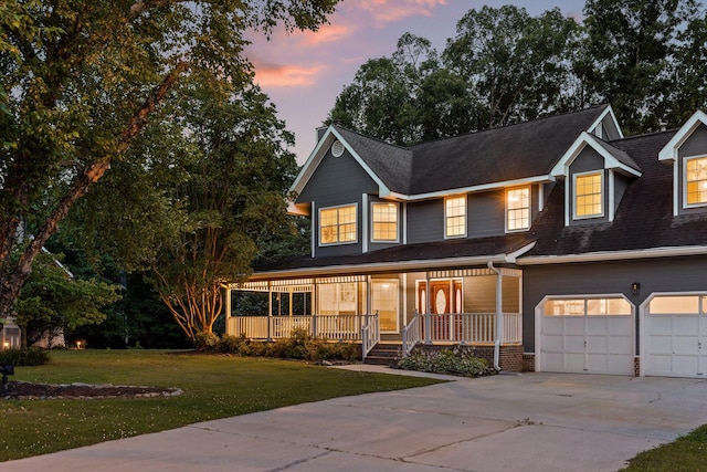 8512 Creek Stone Dr, Chattanooga, TN 37421 - view of front of house with covered porch, concrete driveway, a front lawn, and roof with shingles