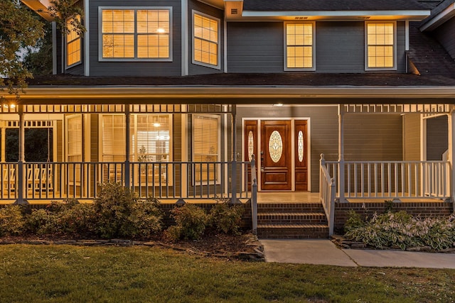 8512 Creek Stone Dr, Chattanooga, TN 37421 - view of front of house featuring a porch, a shingled roof, and a front lawn