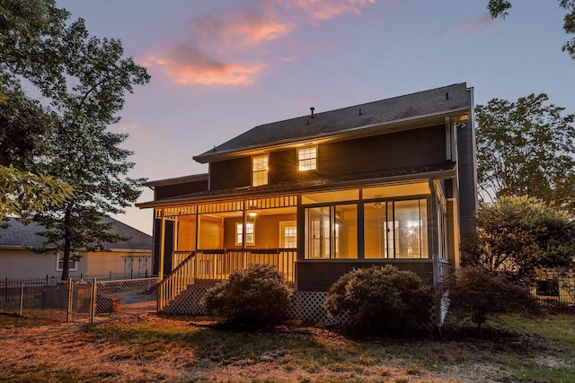 8512 Creek Stone Dr, Chattanooga, TN 37421 - back of house at dusk featuring a porch