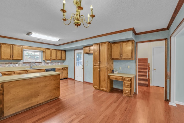 1259 Leaside Ln, Hixson, TN 37343 - kitchen featuring brown cabinetry, light countertops, a textured ceiling, dishwasher, and light wood finished floors