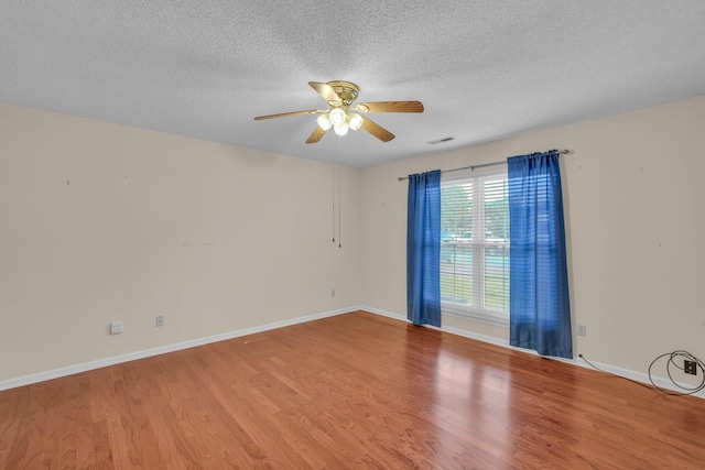 1259 Leaside Ln, Hixson, TN 37343 - spare room featuring ceiling fan, wood finished floors, and a textured ceiling