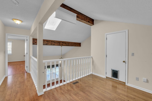 1259 Leaside Ln, Hixson, TN 37343 - hall featuring a skylight and wood finished floors