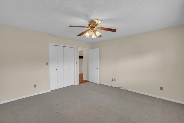 1259 Leaside Ln, Hixson, TN 37343 - unfurnished bedroom featuring carpet, a closet, ceiling fan, and a textured ceiling