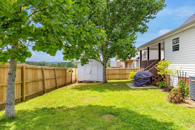 750 Windrush Loop, Chattanooga, TN 37421 - fenced backyard featuring a storage shed