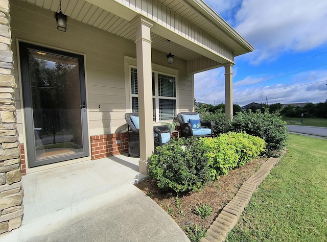 179 Trade Wind Dr, Fort Oglethorpe, GA 30742 - property entrance featuring covered porch and brick siding