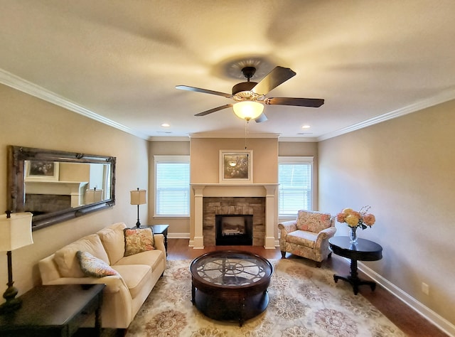 179 Trade Wind Dr, Fort Oglethorpe, GA 30742 - living area with a fireplace, wood finished floors, healthy amount of natural light, and crown molding