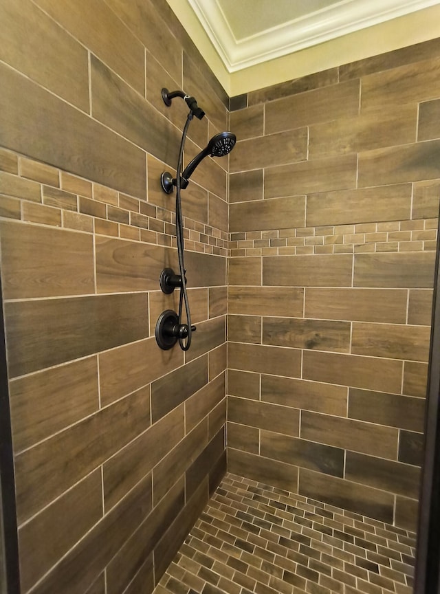 179 Trade Wind Dr, Fort Oglethorpe, GA 30742 - bathroom with ornamental molding and a tile shower