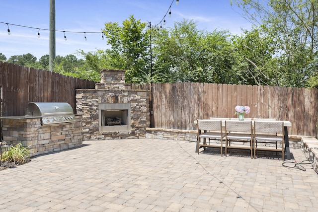 3528 Morning Dew Cv, Apison, TN 37302 - view of patio with an outdoor stone fireplace, area for grilling, and outdoor dining area