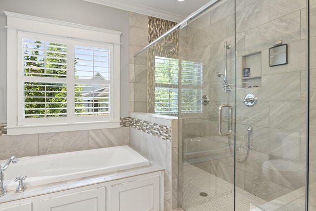 3528 Morning Dew Cv, Apison, TN 37302 - bathroom with crown molding, a garden tub, healthy amount of natural light, and a shower stall